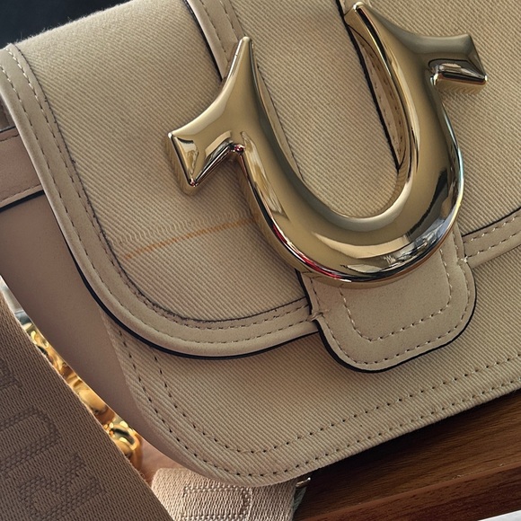 True Religion Handbags - True Religion Cream Crossbody Bag with Gold Accent